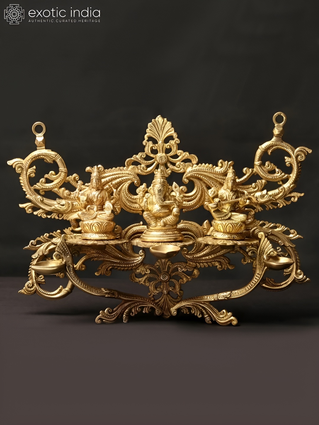 Exotic India 14'' Alluring Lakshmi Ganesha Saraswati Wall Hanging With Dipam in Brass, Gold
Exotic India 14'' Alluring Lakshmi Ganesha Saraswati Wall Hanging With Dipam in Brass, Gold