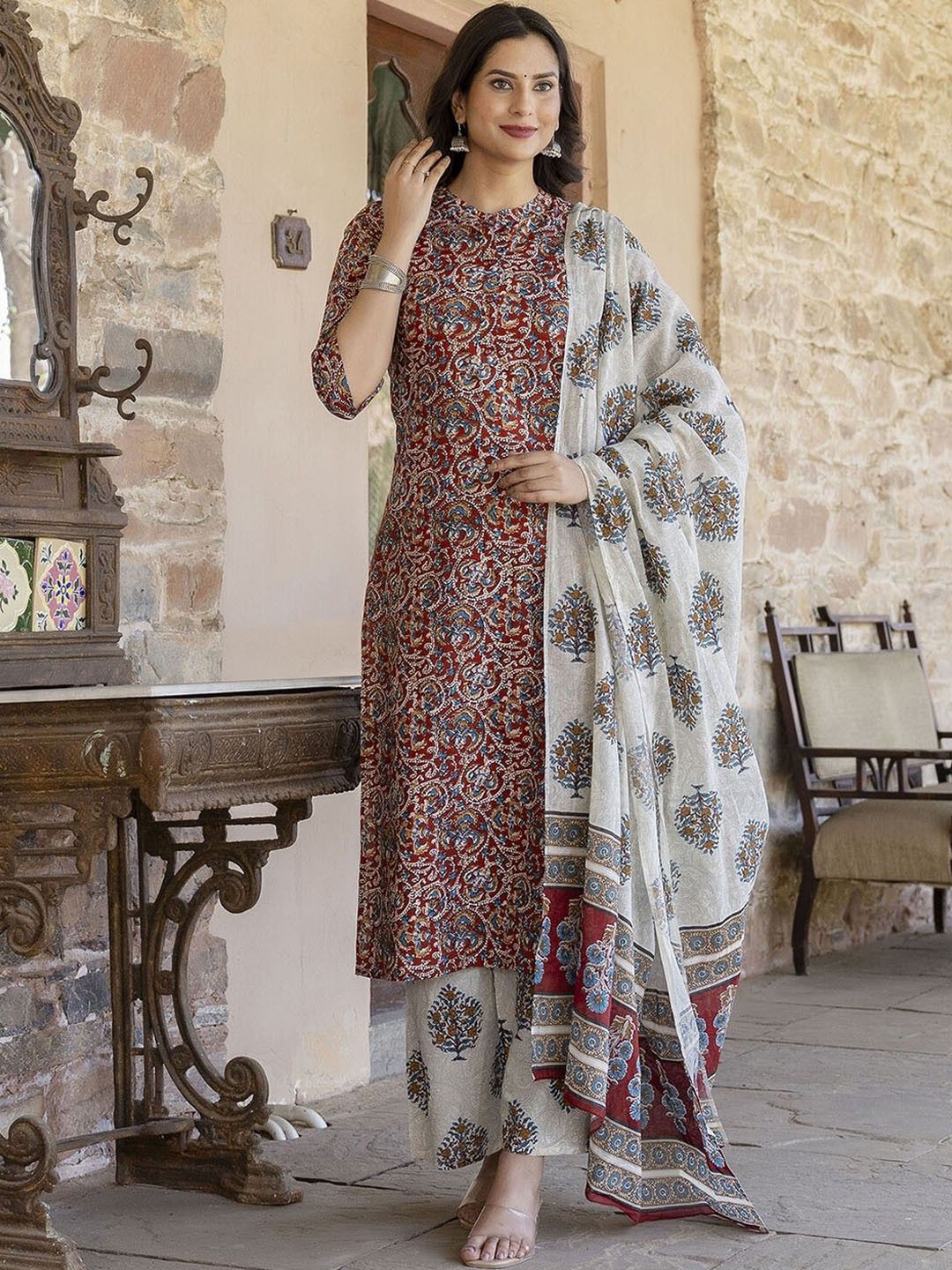KALINI Floral Printed Mandarin Collar Straight Kurta with Trousers & Dupatta, Maroon
KALINI Floral Printed Mandarin Collar Straight Kurta with Trousers & Dupatta, Maroon