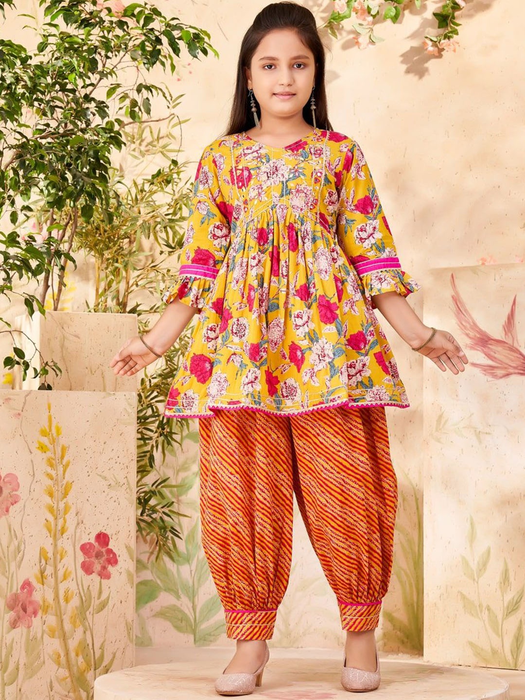 BAESD Girls Floral Printed Pleated Mirror Work Pure Cotton A-Line Kurta With Patiala, Mustard
BAESD Girls Floral Printed Pleated Mirror Work Pure Cotton A-Line Kurta With Patiala, Mustard