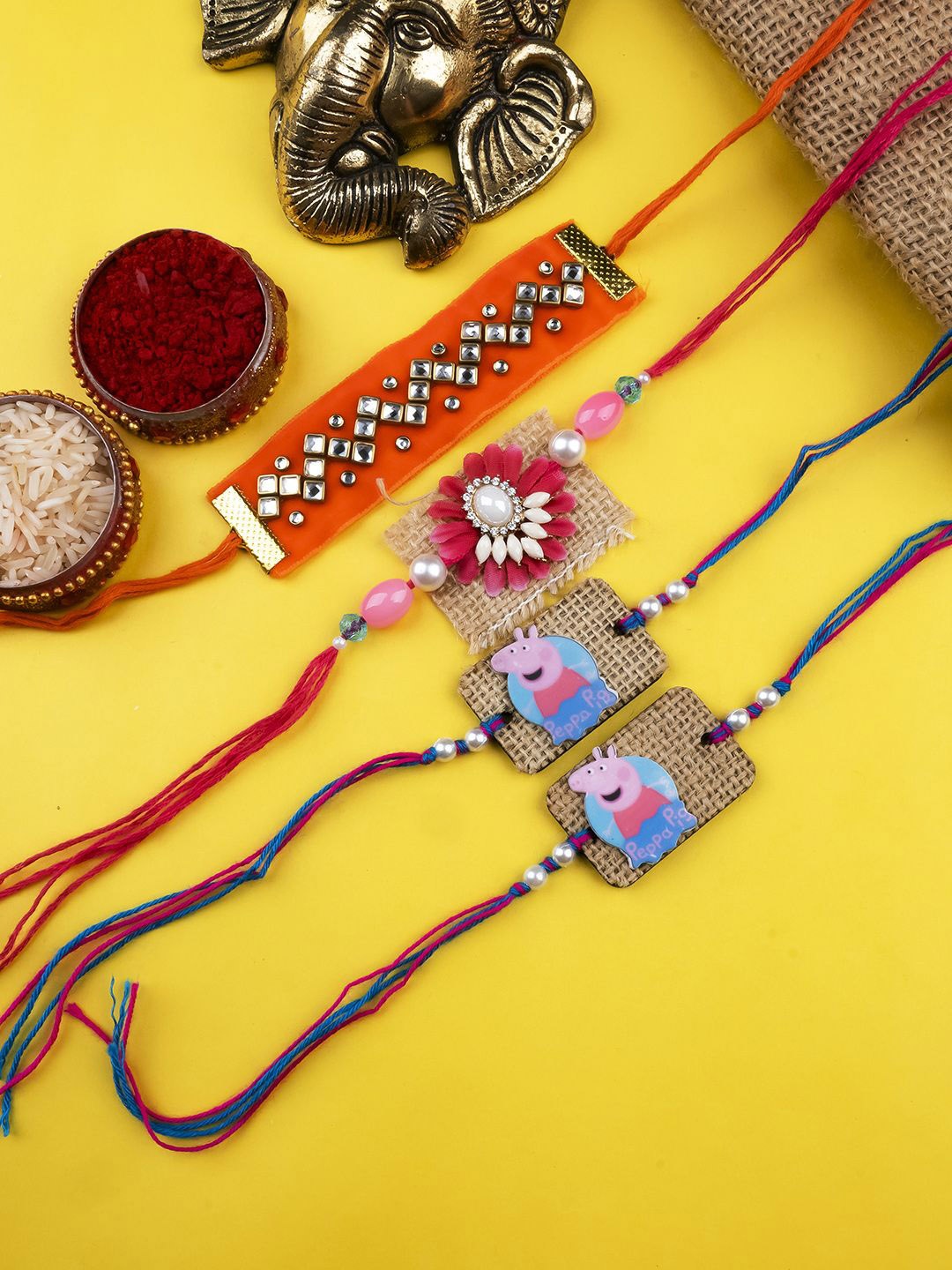 StileAdda Set Of 4 Beaded Thread Rakhis With Roli & Chawal With Chandan And Mishri, Red
StileAdda Set Of 4 Beaded Thread Rakhis With Roli & Chawal With Chandan And Mishri, Red