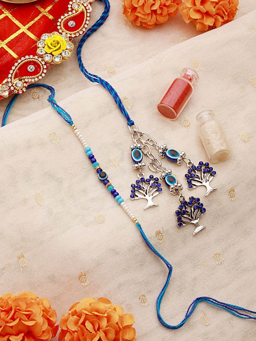Jazz and Sizzle Beaded Evil Eye Thread Bhaiya Bhabhi Rakhis with Roli Chawal, Blue
Jazz and Sizzle Beaded Evil Eye Thread Bhaiya Bhabhi Rakhis with Roli Chawal, Blue