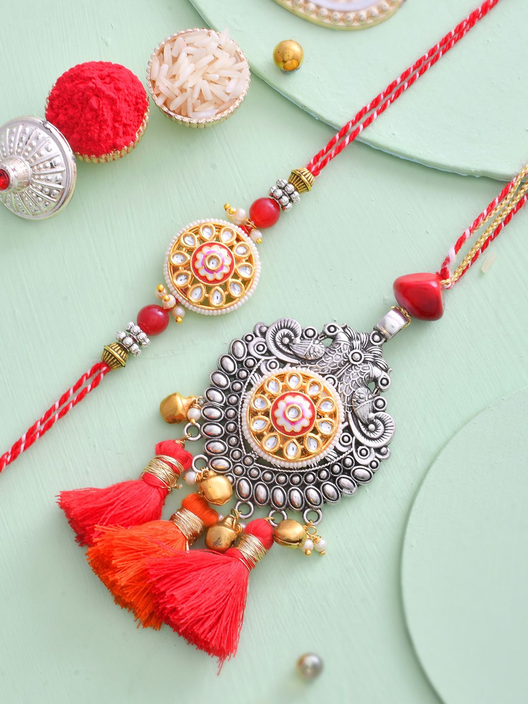 Aapno Rajasthan Stone Studded & Beaded Bhaiya Bhabhi Thread Rakhis with Roli Chawal, Red
Aapno Rajasthan Stone Studded & Beaded Bhaiya Bhabhi Thread Rakhis with Roli Chawal, Red