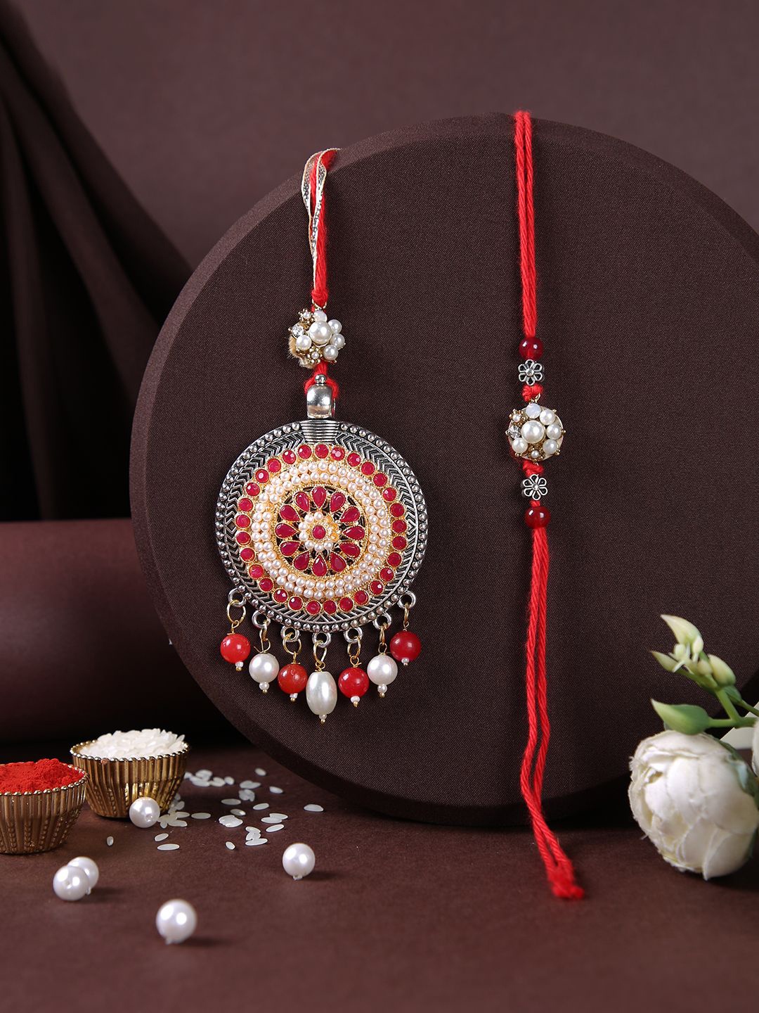 Aapno Rajasthan Stone Studded & Beaded Bhaiya Bhabhi Thread Rakhis with Roli Chawal, Red
Aapno Rajasthan Stone Studded & Beaded Bhaiya Bhabhi Thread Rakhis with Roli Chawal, Red