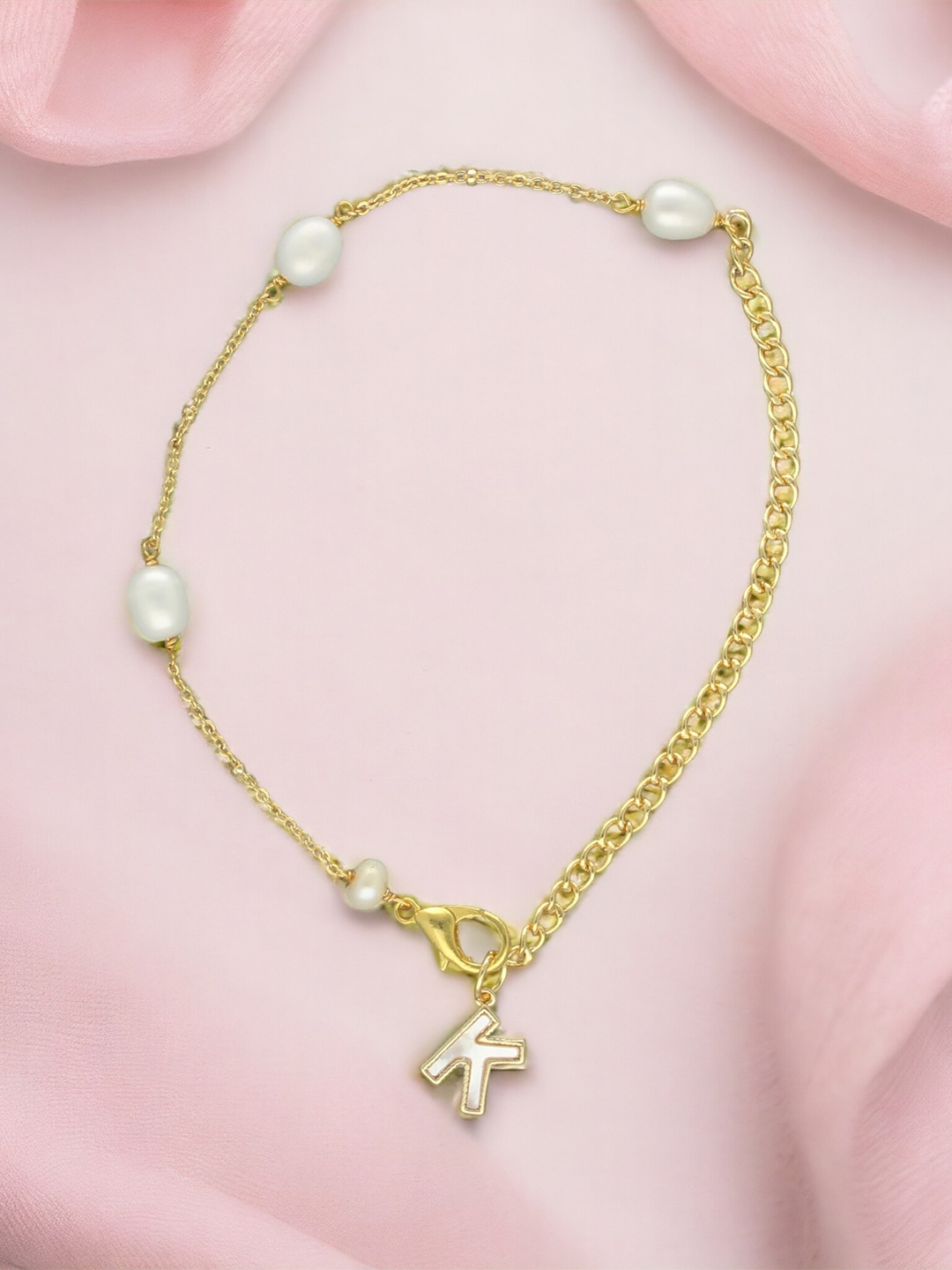 Sri Jagdamba Pearls Dealer Gold-Plated Mother of Pearl Studded K Alphabet Charm Bracelet
Sri Jagdamba Pearls Dealer Gold-Plated Mother of Pearl Studded K Alphabet Charm Bracelet