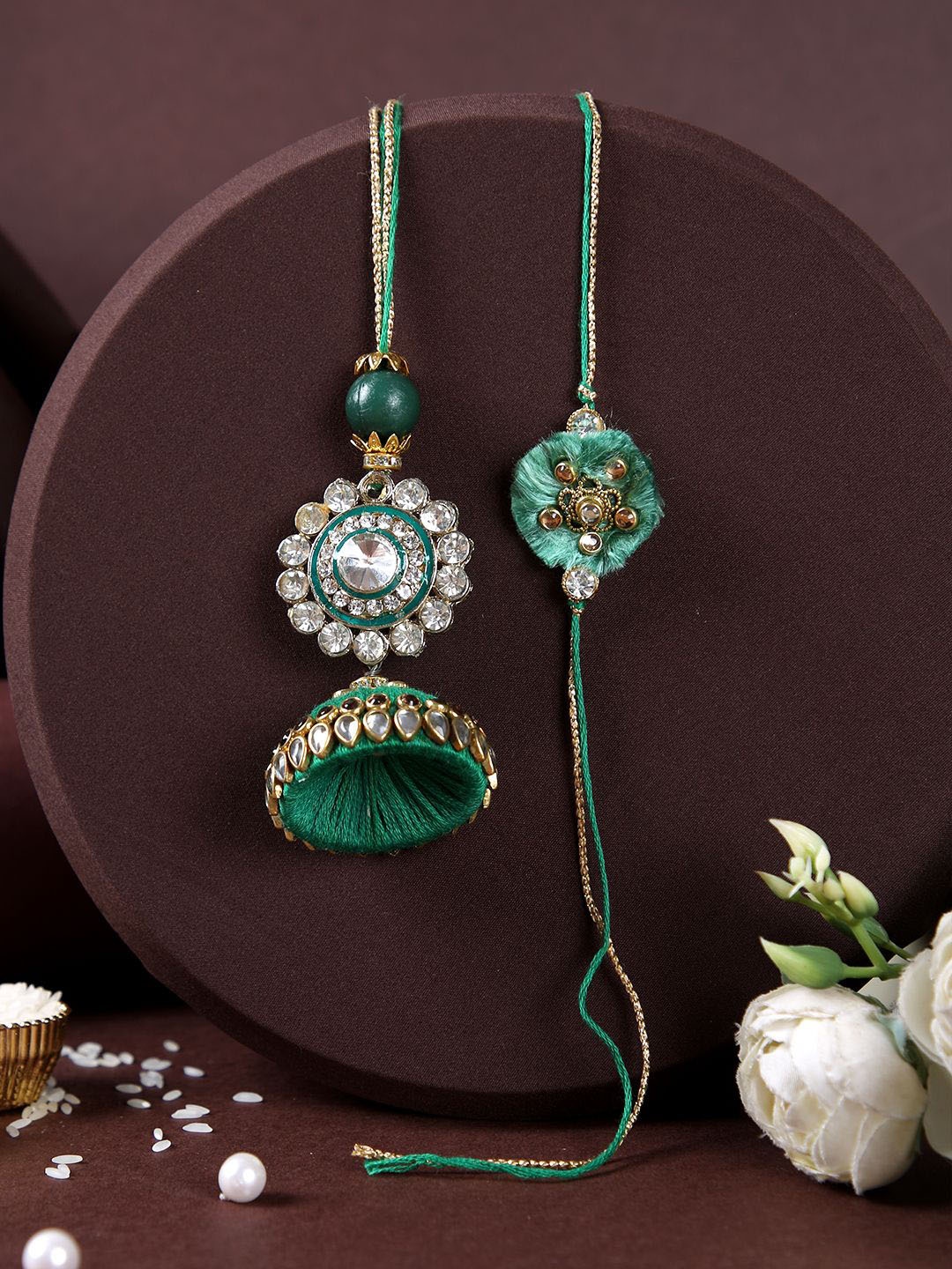 Aapno Rajasthan Flower With Dome Shaped Lumba Rakhi With Roli Chawal & Card, Green
Aapno Rajasthan Flower With Dome Shaped Lumba Rakhi With Roli Chawal & Card, Green