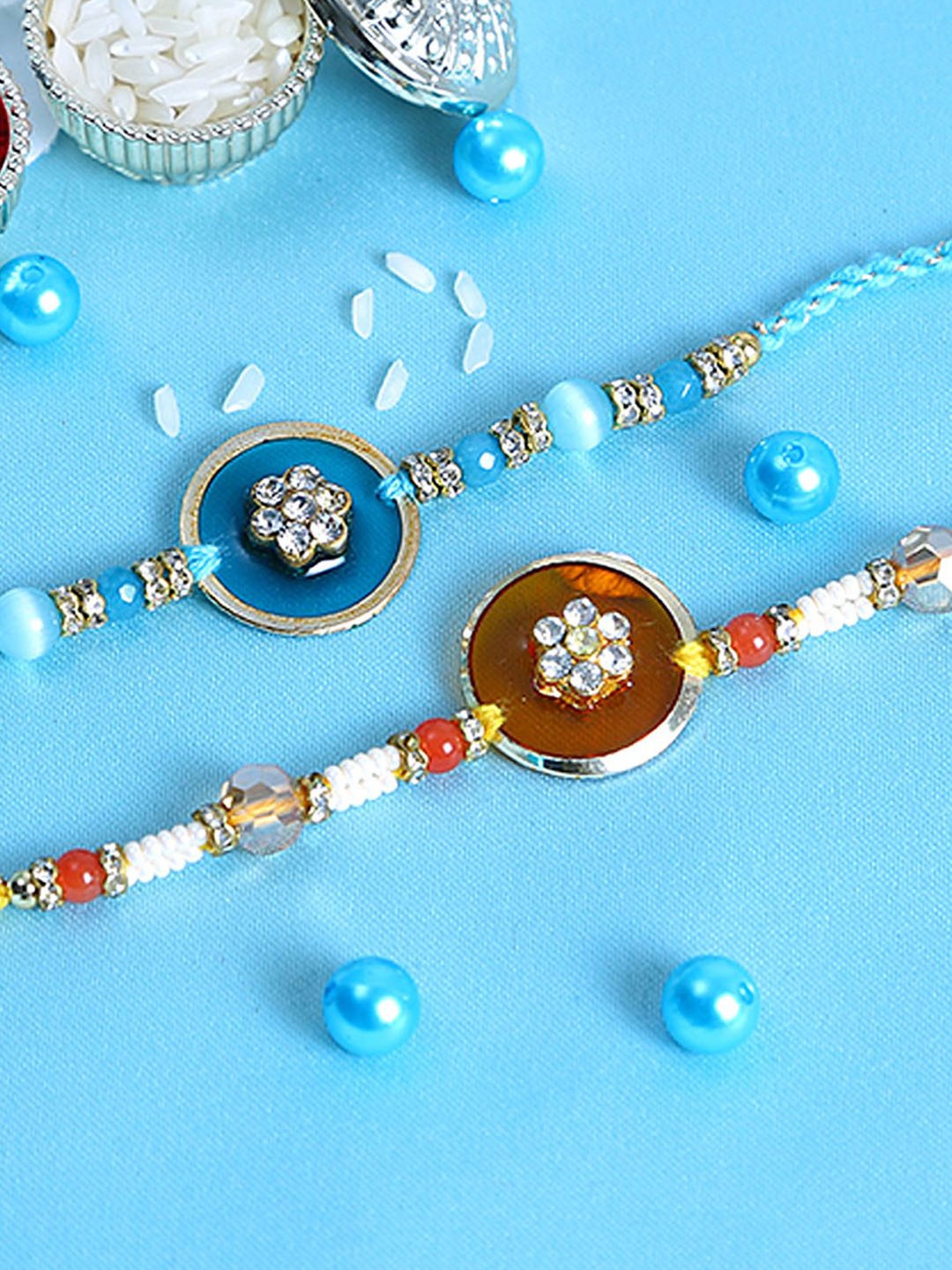 Anouk Set Of 2 Blue Stones Studded & Beaded Rakhis Comes With Roli Rice & Greeting Card
Anouk Set Of 2 Blue Stones Studded & Beaded Rakhis Comes With Roli Rice & Greeting Card