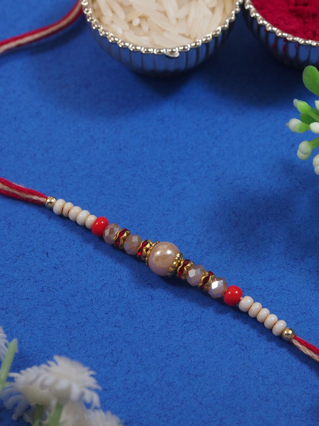 I Jewels Pearls Beaded Thread Rakhi With Roli Chawal & Greeting Card, White
I Jewels Pearls Beaded Thread Rakhi With Roli Chawal & Greeting Card, White