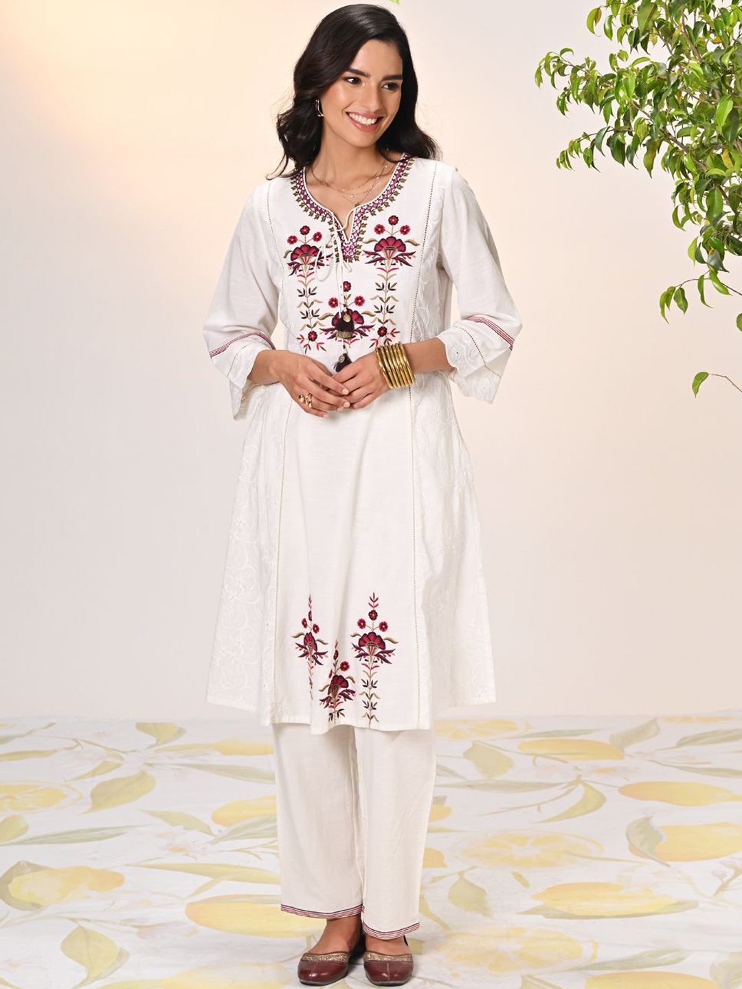 Lakshita Floral Embroidered Tie-Up Neck Cotton & Linen A-Line Kurta with Trousers, Off white
Lakshita Floral Embroidered Tie-Up Neck Cotton & Linen A-Line Kurta with Trousers, Off white