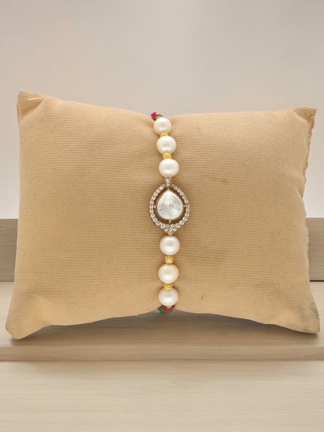 Sri Jagdamba Pearls Dealer Fresh Water Pearls & Cubic Zirconia Thread Rakhi, Gold
Sri Jagdamba Pearls Dealer Fresh Water Pearls & Cubic Zirconia Thread Rakhi, Gold