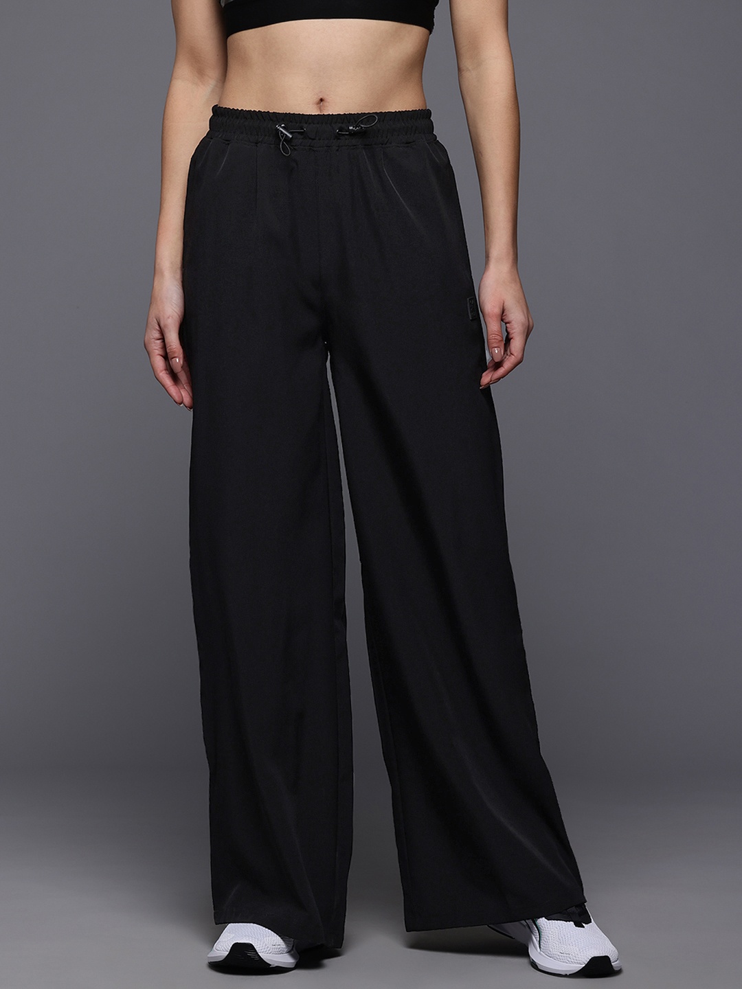 HRX by Hrithik Roshan Women Mid-Rise Regular Fit Lifestyle Flared Track Pants, Black
HRX by Hrithik Roshan Women Mid-Rise Regular Fit Lifestyle Flared Track Pants, Black