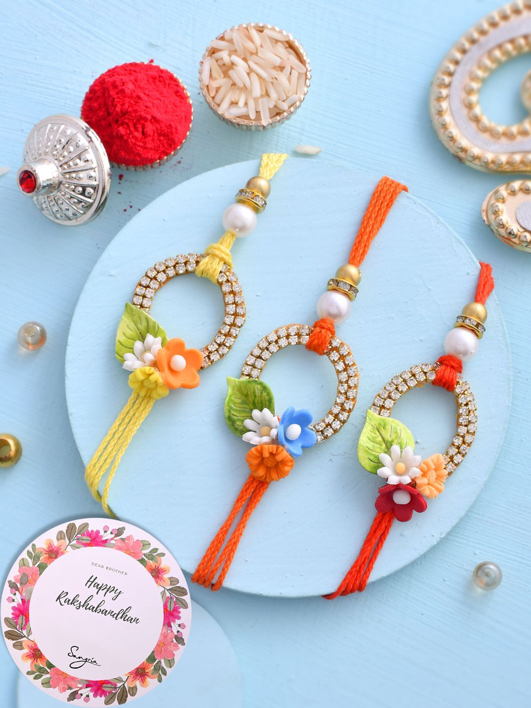 Sangria Set Of 3 Floral Stone Studded & Beaded Rakhi With Roli Chawal & Greeting Card, Yellow
Sangria Set Of 3 Floral Stone Studded & Beaded Rakhi With Roli Chawal & Greeting Card, Yellow