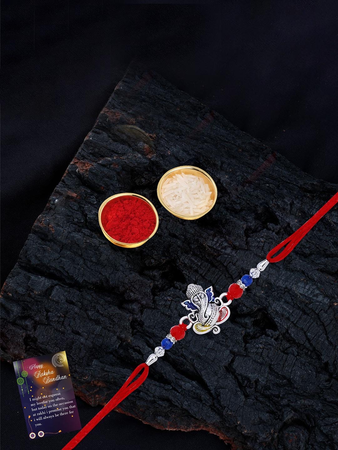 Silver Shine Set Of 2 Beaded and Ganesha Thread Rakhis with Greeting Card & Roli Chawal, Gold
Silver Shine Set Of 2 Beaded and Ganesha Thread Rakhis with Greeting Card & Roli Chawal, Gold