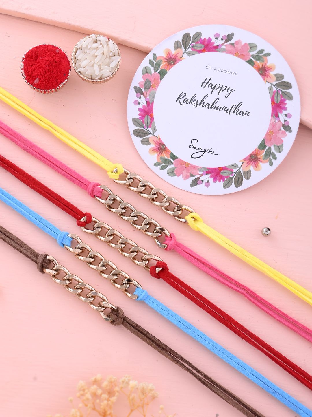 Sangria Set Of 5 Trendy and Cool Bracelet Rakhi With Greeting Card & Roli Chawal, Gold
Sangria Set Of 5 Trendy and Cool Bracelet Rakhi With Greeting Card & Roli Chawal, Gold