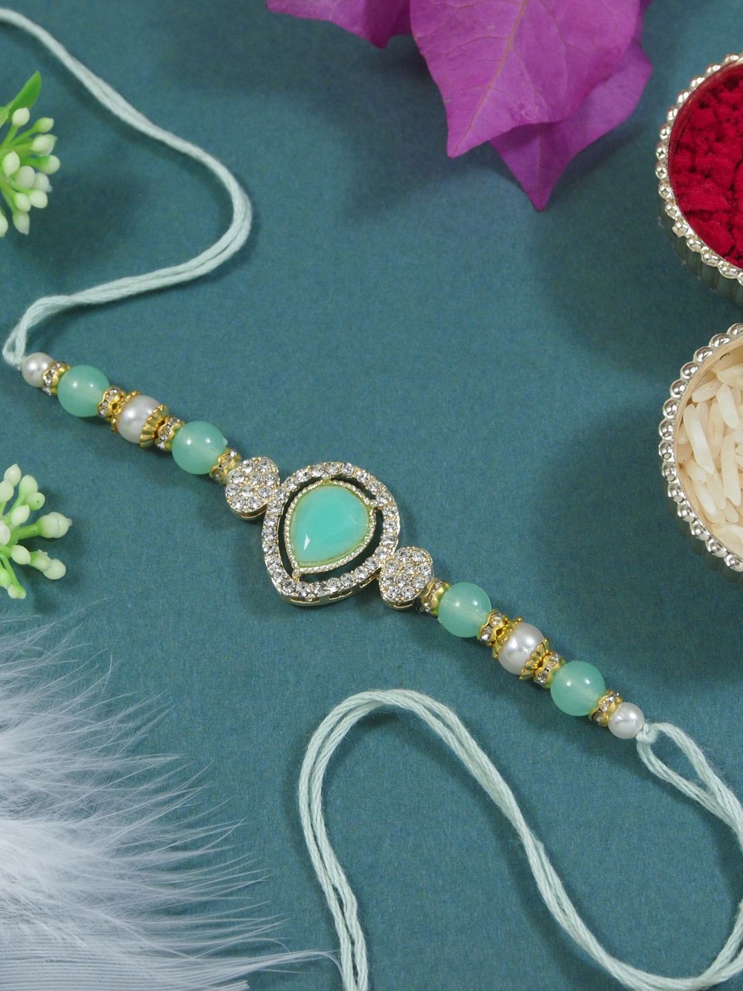 I Jewels Kundan Studded Pearl Beaded Thread Rakhi With Roli Chawal & Rakshabandhan Card, Sea green
I Jewels Kundan Studded Pearl Beaded Thread Rakhi With Roli Chawal & Rakshabandhan Card, Sea green