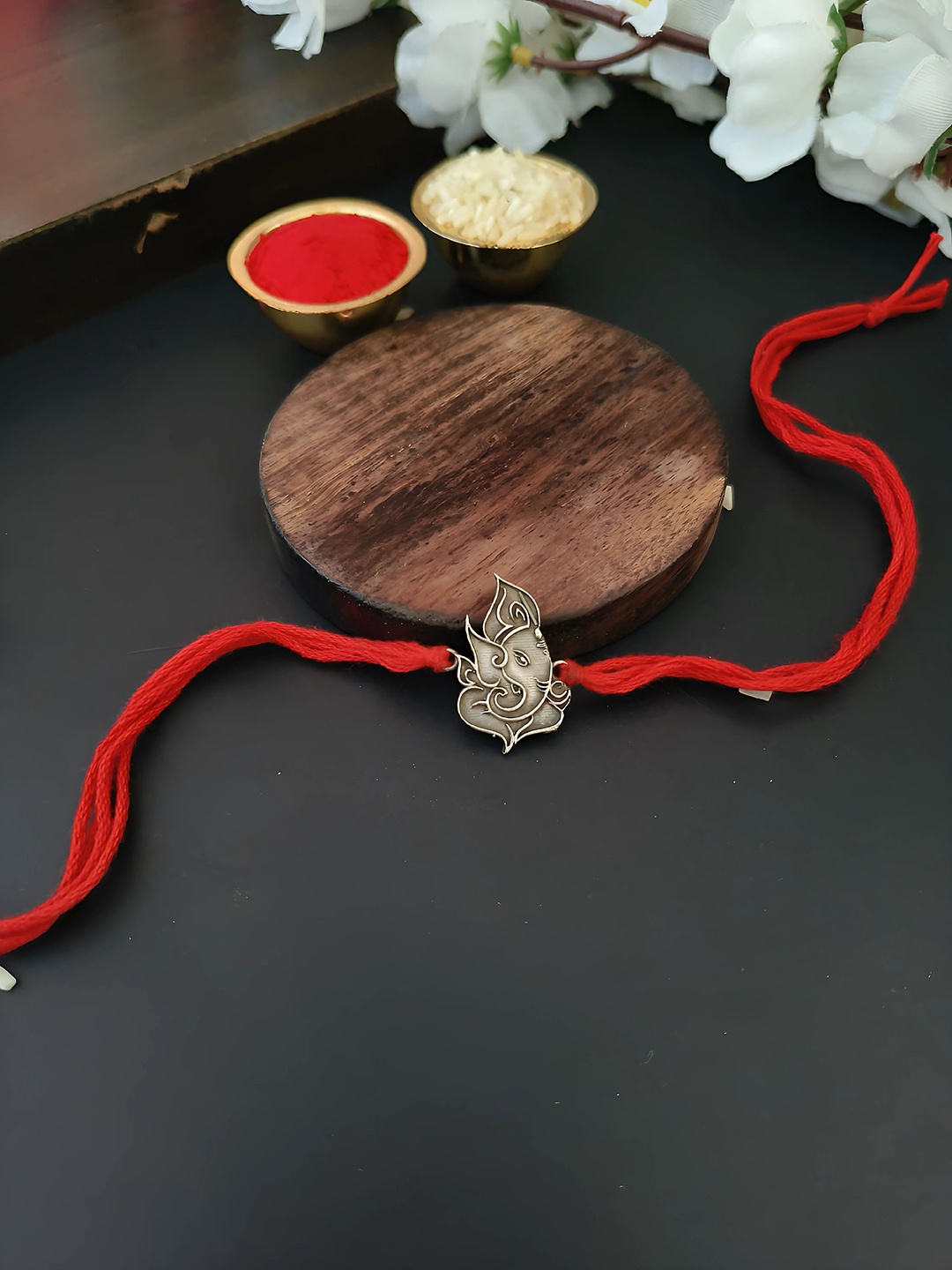 Sangria Silver Plated Ganesha Charm Thread Rakhi With Roli Chawal & Greeting Card, Red
Sangria Silver Plated Ganesha Charm Thread Rakhi With Roli Chawal & Greeting Card, Red