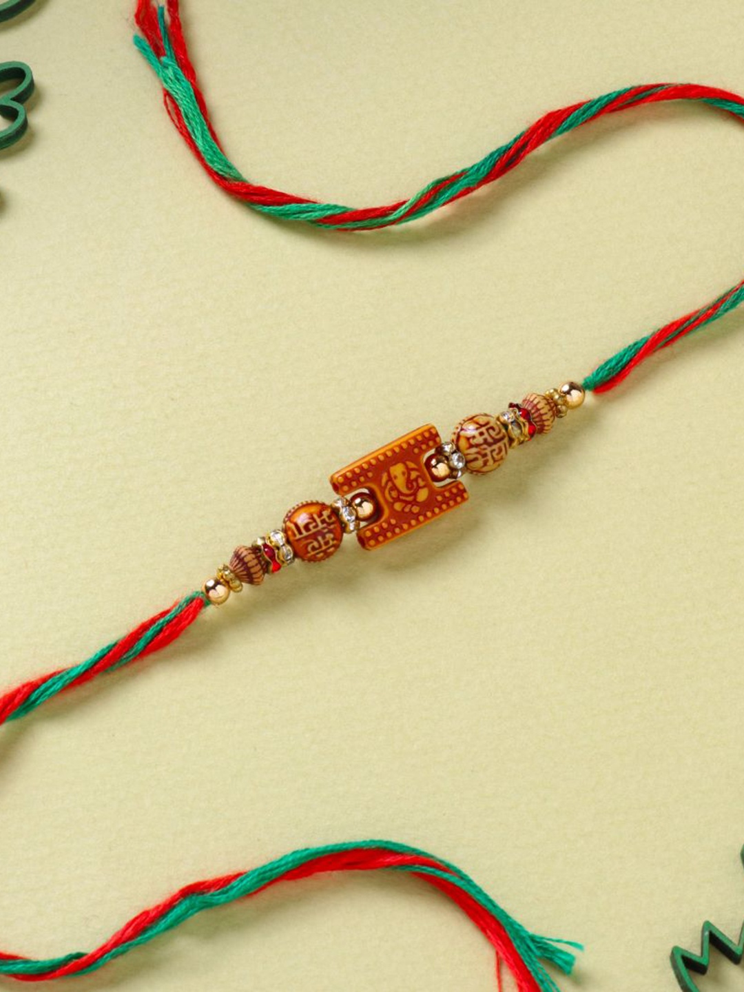 Floweraura Auspicious Lord Ganesha Beaded Thread Bracelet Rakhi with Roli Chawal, Red
Floweraura Auspicious Lord Ganesha Beaded Thread Bracelet Rakhi with Roli Chawal, Red
