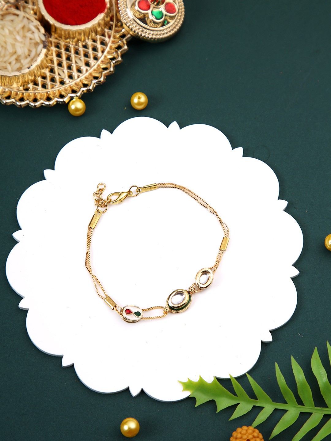 House of Pataudi Kundan Studded Bracelet Rakhi With Greeting Card & Roli Chawal, Gold
House of Pataudi Kundan Studded Bracelet Rakhi With Greeting Card & Roli Chawal, Gold