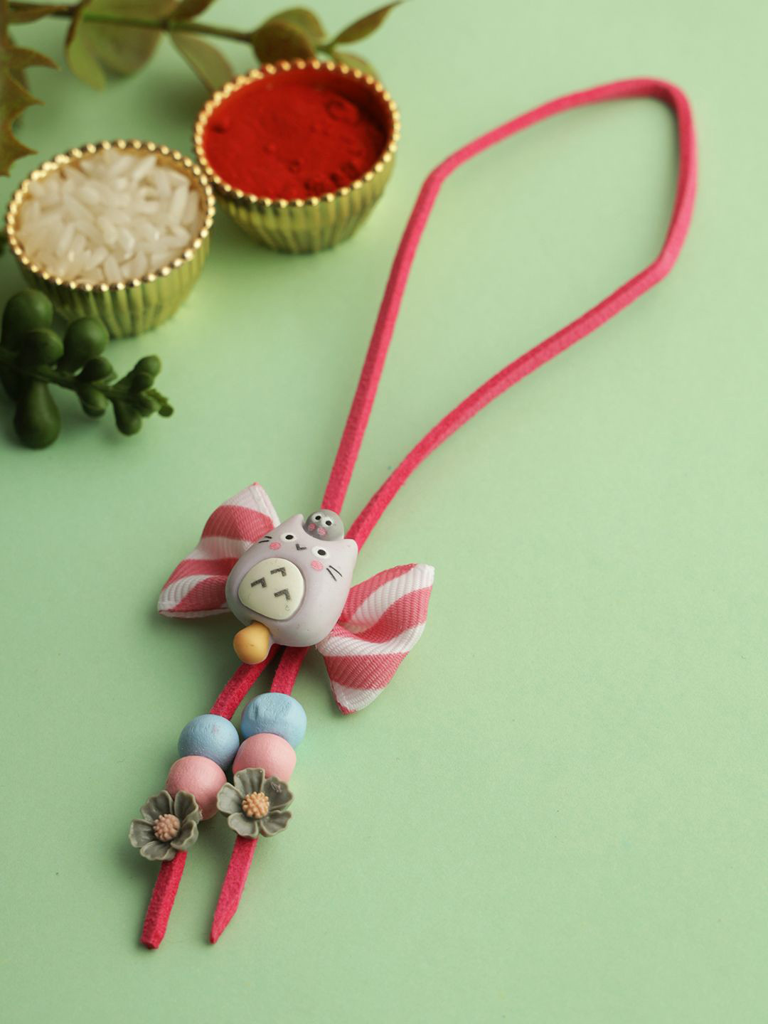Kook N Keech Pink Bow with Cat and Beads Lumba Rakhi with Roli Chawal & Greeting Card
Kook N Keech Pink Bow with Cat and Beads Lumba Rakhi with Roli Chawal & Greeting Card