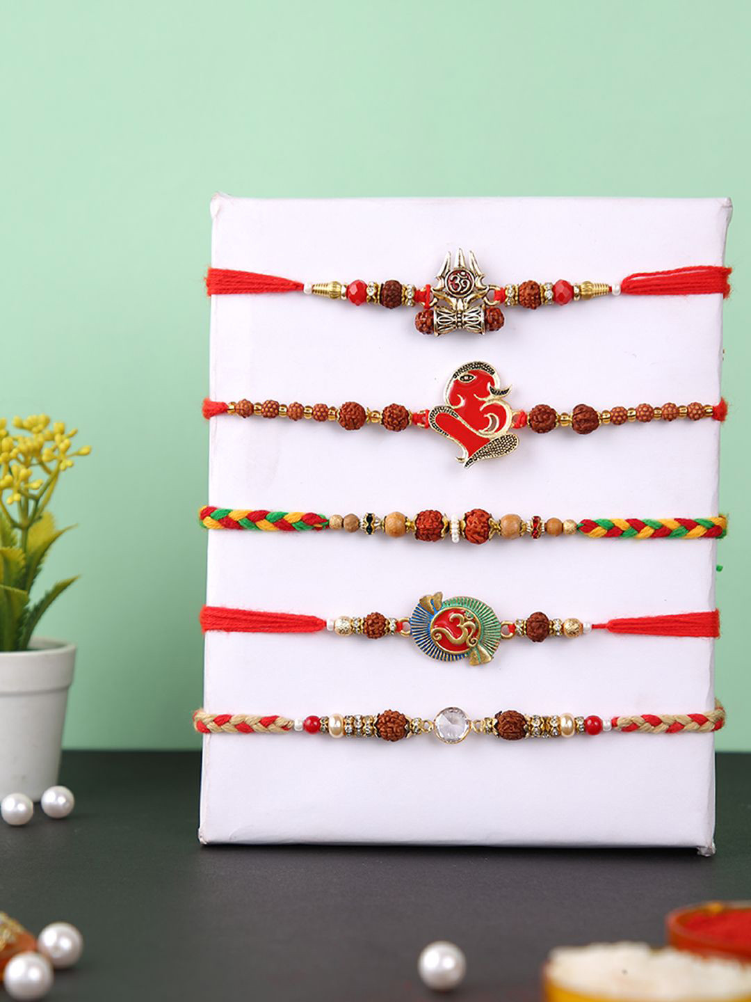 Anouk Set Of 5 Rudraksh & Swastik Beaded Thread Rakhi With Roli Chawal & Greetings Card, Brown
Anouk Set Of 5 Rudraksh & Swastik Beaded Thread Rakhi With Roli Chawal & Greetings Card, Brown