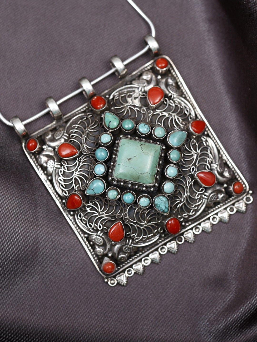 Exotic India Turquoise and Coral Gemstone Tibetan Filigree Sterling Silver Pendant
Exotic India Turquoise and Coral Gemstone Tibetan Filigree Sterling Silver Pendant