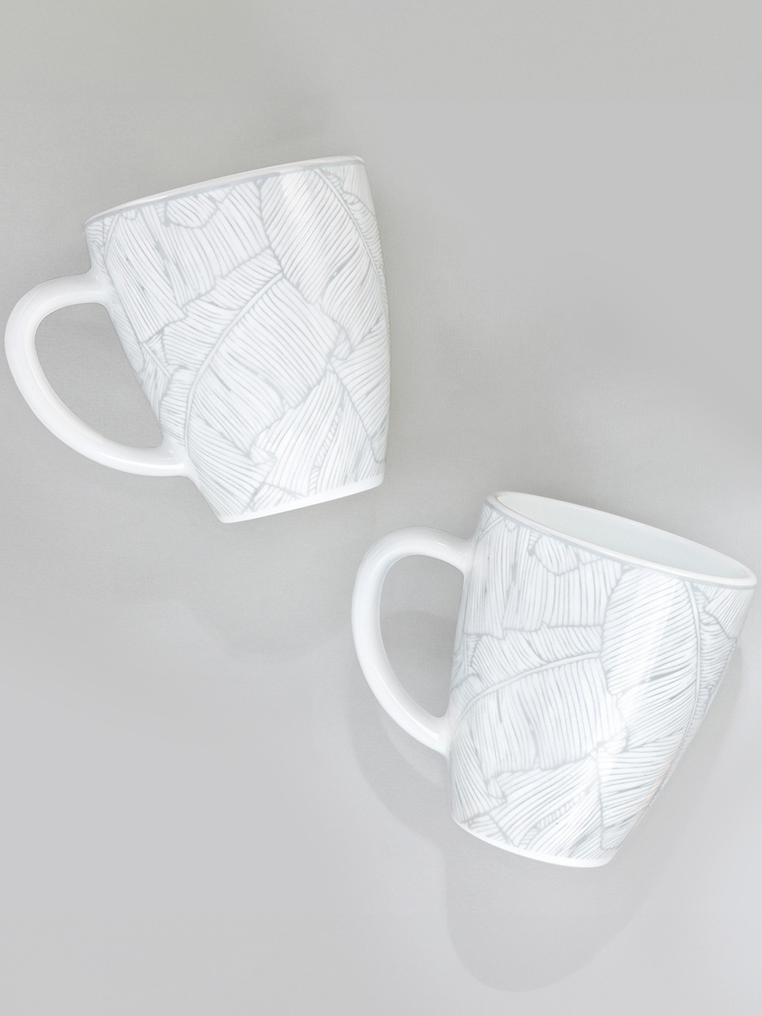 Larah by BOROSIL Premia Series Ivy White & Grey 2Pcs Leaf Printed Opalware Mugs 390ml Each
Larah by BOROSIL Premia Series Ivy White & Grey 2Pcs Leaf Printed Opalware Mugs 390ml Each