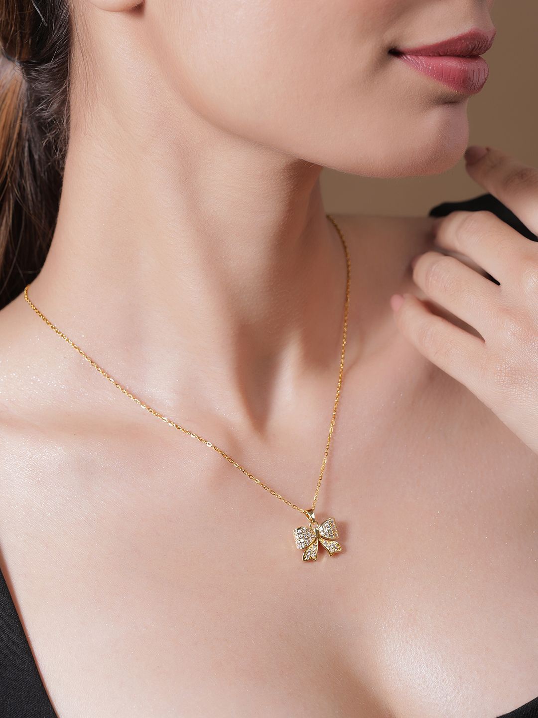 Rubans 18K Gold Plated Stainless Steel Tarnish-Free Waterproof CZ Demi-Fine Bow Pendant
Rubans 18K Gold Plated Stainless Steel Tarnish-Free Waterproof CZ Demi-Fine Bow Pendant
