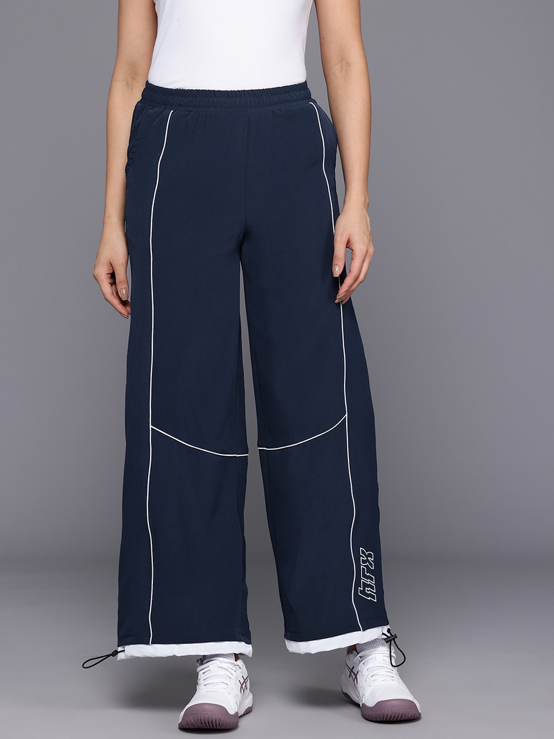 HRX by Hrithik Roshan Women Mid-Rise Lifestyle Track Pants with Toggle Hem, Navy blue
HRX by Hrithik Roshan Women Mid-Rise Lifestyle Track Pants with Toggle Hem, Navy blue