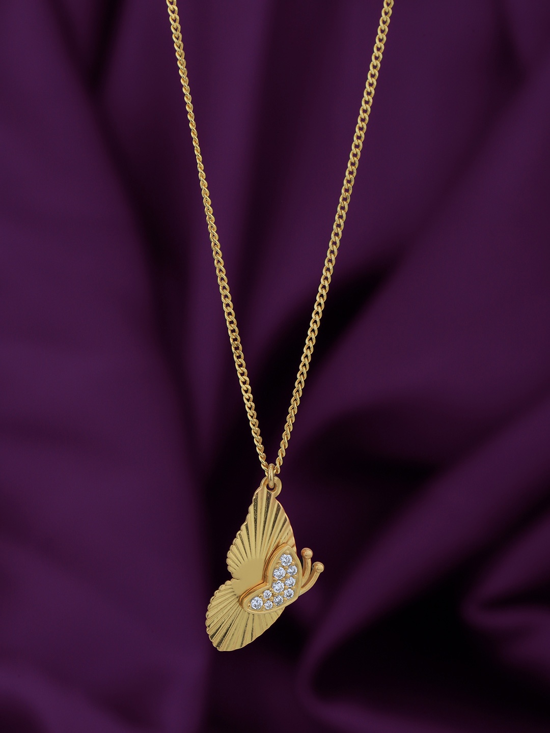 Carlton London 18kt Gold Plated with Cubic Zirconia Studded Butterfly Pendant and Chain
Carlton London 18kt Gold Plated with Cubic Zirconia Studded Butterfly Pendant and Chain