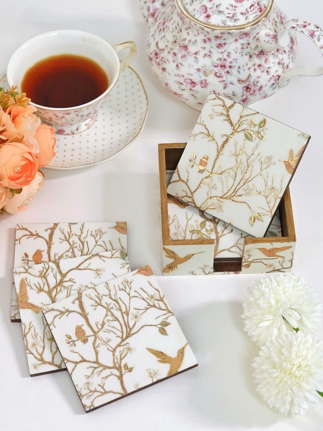 CasaGold White & Gold Toned 7 Pieces Floral Printed Wooden Coasters With Tissue Holder
CasaGold White & Gold Toned 7 Pieces Floral Printed Wooden Coasters With Tissue Holder