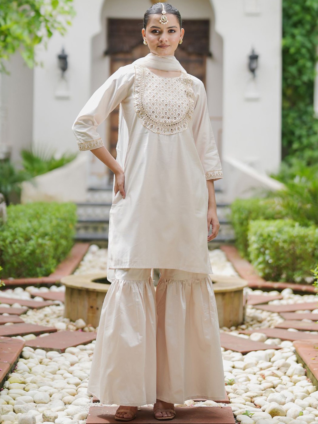 Indo Era Floral Embroidered Gotta Patti Liva Kurta with Sharara & Dupatta, Off white
Indo Era Floral Embroidered Gotta Patti Liva Kurta with Sharara & Dupatta, Off white