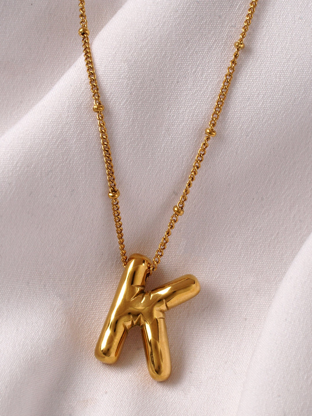 AQUASTREET Stainless Steel 18K Gold Plated Anti Tarnish Balloon K Pendant With Chain
AQUASTREET Stainless Steel 18K Gold Plated Anti Tarnish Balloon K Pendant With Chain