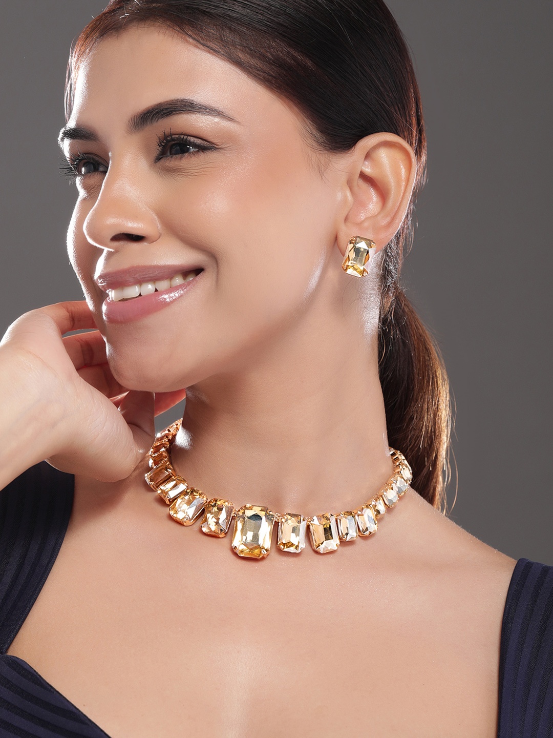 Rubans 18K Gold Plated Champagne Golden Crystal Zicronia Studded Statement Necklace Set
Rubans 18K Gold Plated Champagne Golden Crystal Zicronia Studded Statement Necklace Set