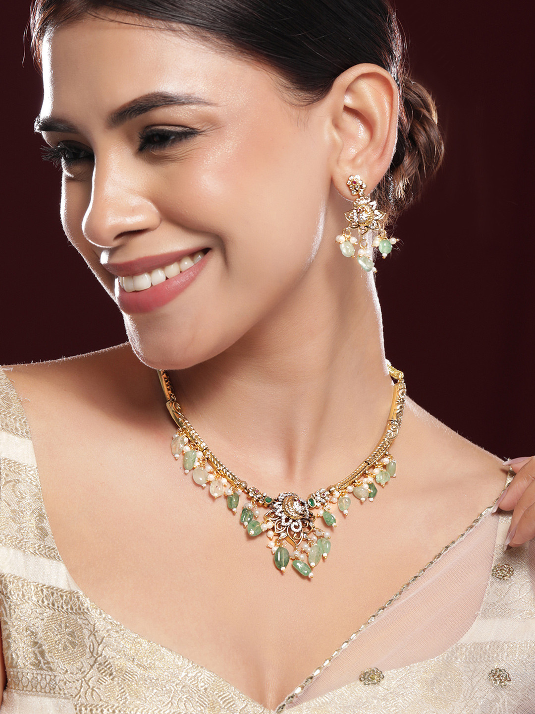 Rubans 22K Gold-Plated with Green Beads Pearls & Cubic Zirconia Temple Jewellery Set
Rubans 22K Gold-Plated with Green Beads Pearls & Cubic Zirconia Temple Jewellery Set