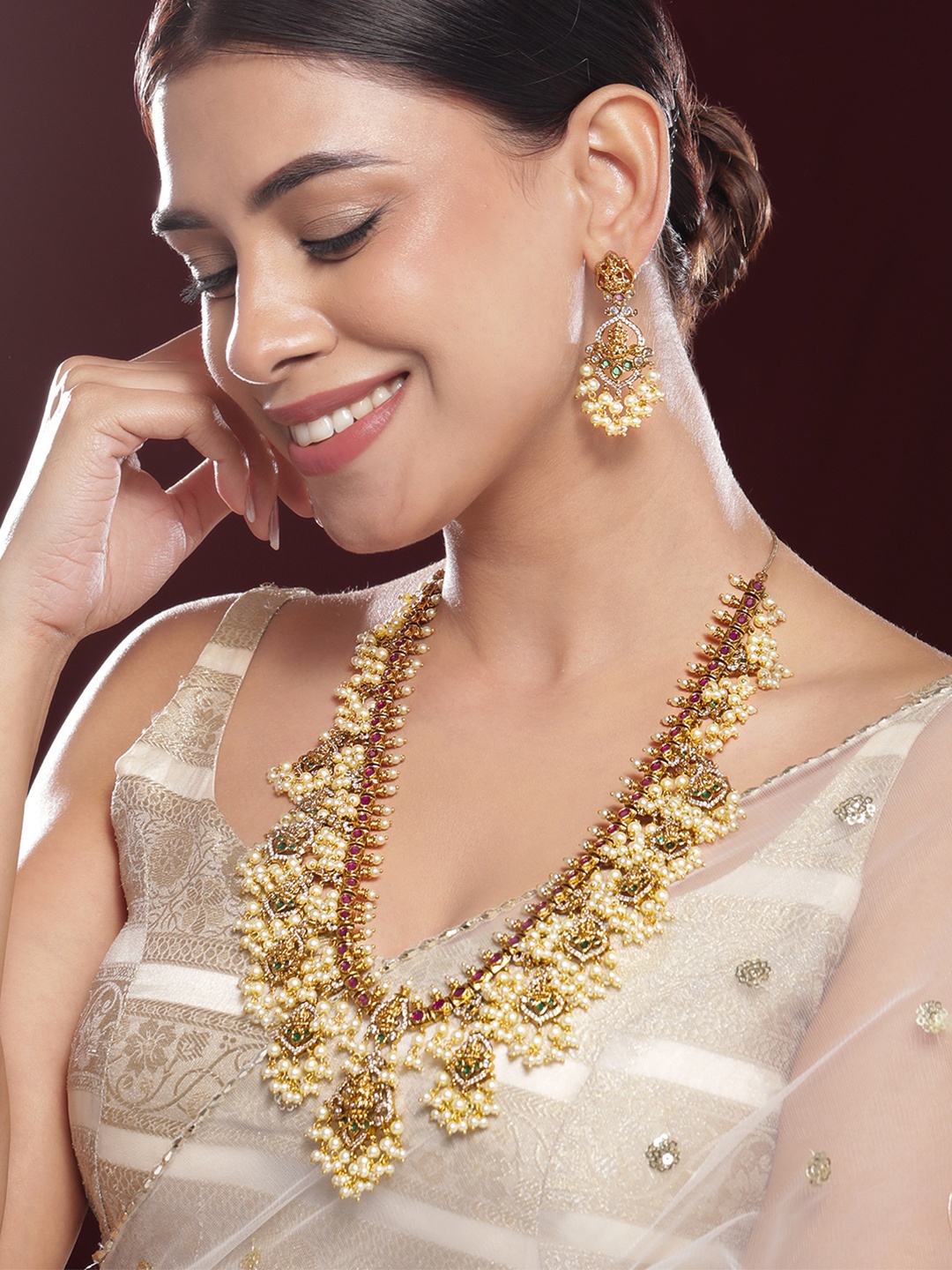 Rubans 22K Gold-Plated Temple Jewellery Set with Pink & Green Stones and Pearl Detailing
Rubans 22K Gold-Plated Temple Jewellery Set with Pink & Green Stones and Pearl Detailing