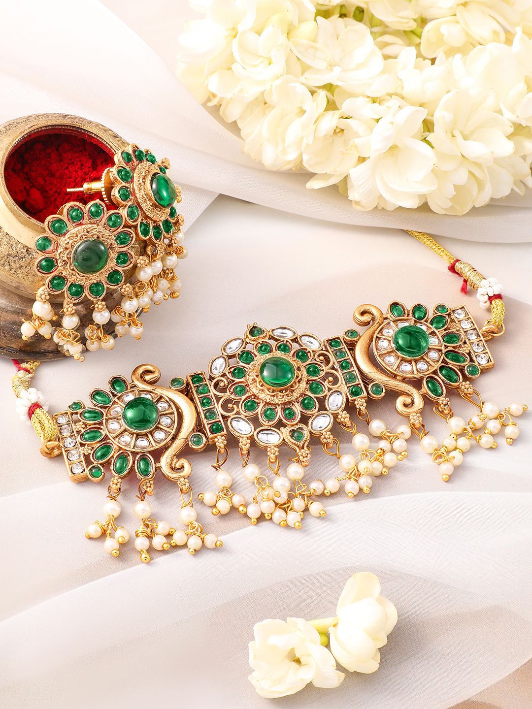 Rubans 22K Gold-Plated Emerald Green Kundan Studded Choker Jewellery Set with Pearl Accent
Rubans 22K Gold-Plated Emerald Green Kundan Studded Choker Jewellery Set with Pearl Accent