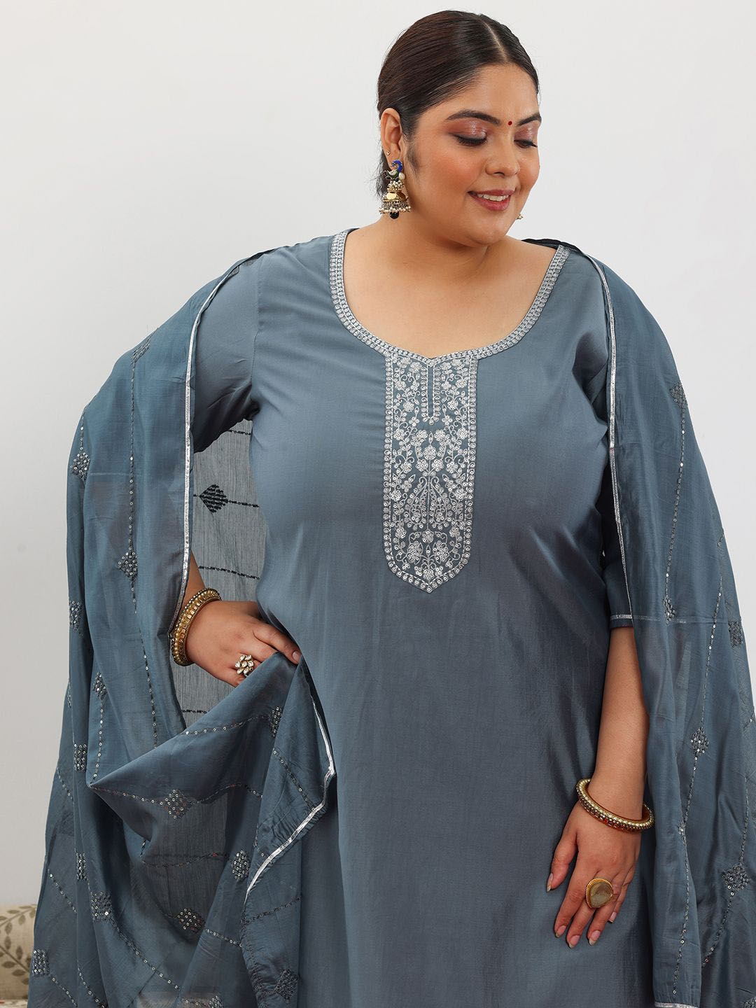 EXTRA LOVE BY LIBAS Plus Size Floral Yoke Design Sequinned Kurta & Trouser & Dupatta, Grey
EXTRA LOVE BY LIBAS Plus Size Floral Yoke Design Sequinned Kurta & Trouser & Dupatta, Grey