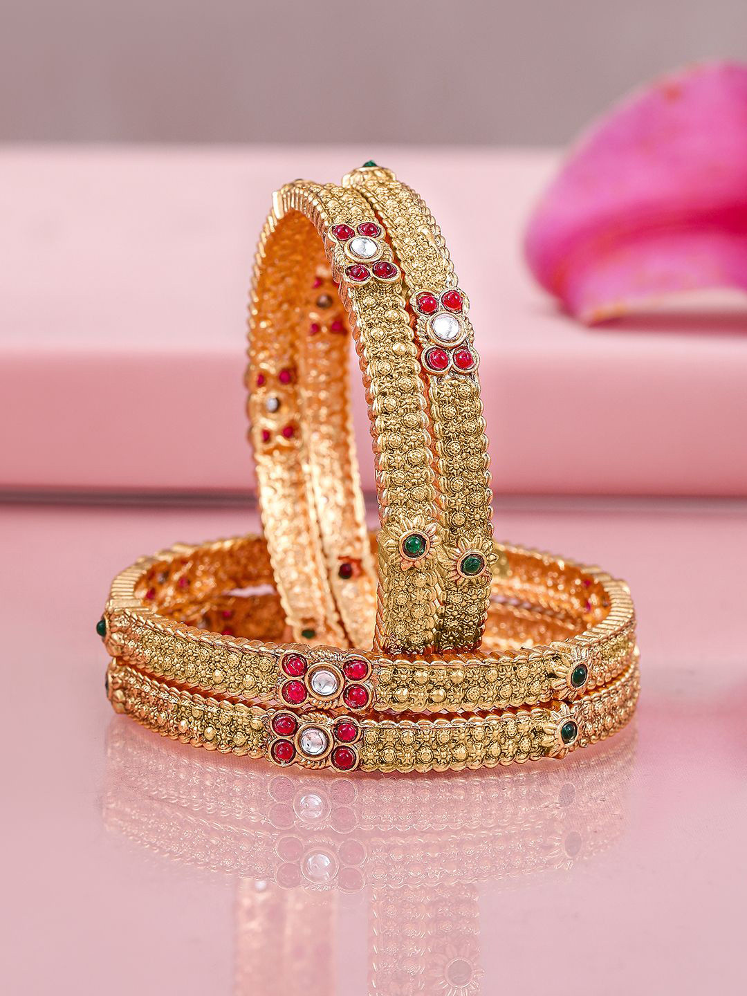 Rubans Set of 4 22K Gold-Plated Bangles with Ruby & Emerald Accents and Kundan Detailing
Rubans Set of 4 22K Gold-Plated Bangles with Ruby & Emerald Accents and Kundan Detailing