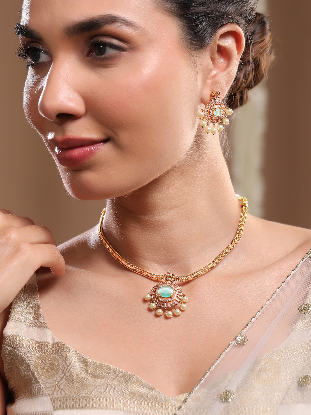 Rubans 22K Gold-Plated Aqua Green & CubicZirconia Traditional Necklace Set with Pearl Drop
Rubans 22K Gold-Plated Aqua Green & CubicZirconia Traditional Necklace Set with Pearl Drop