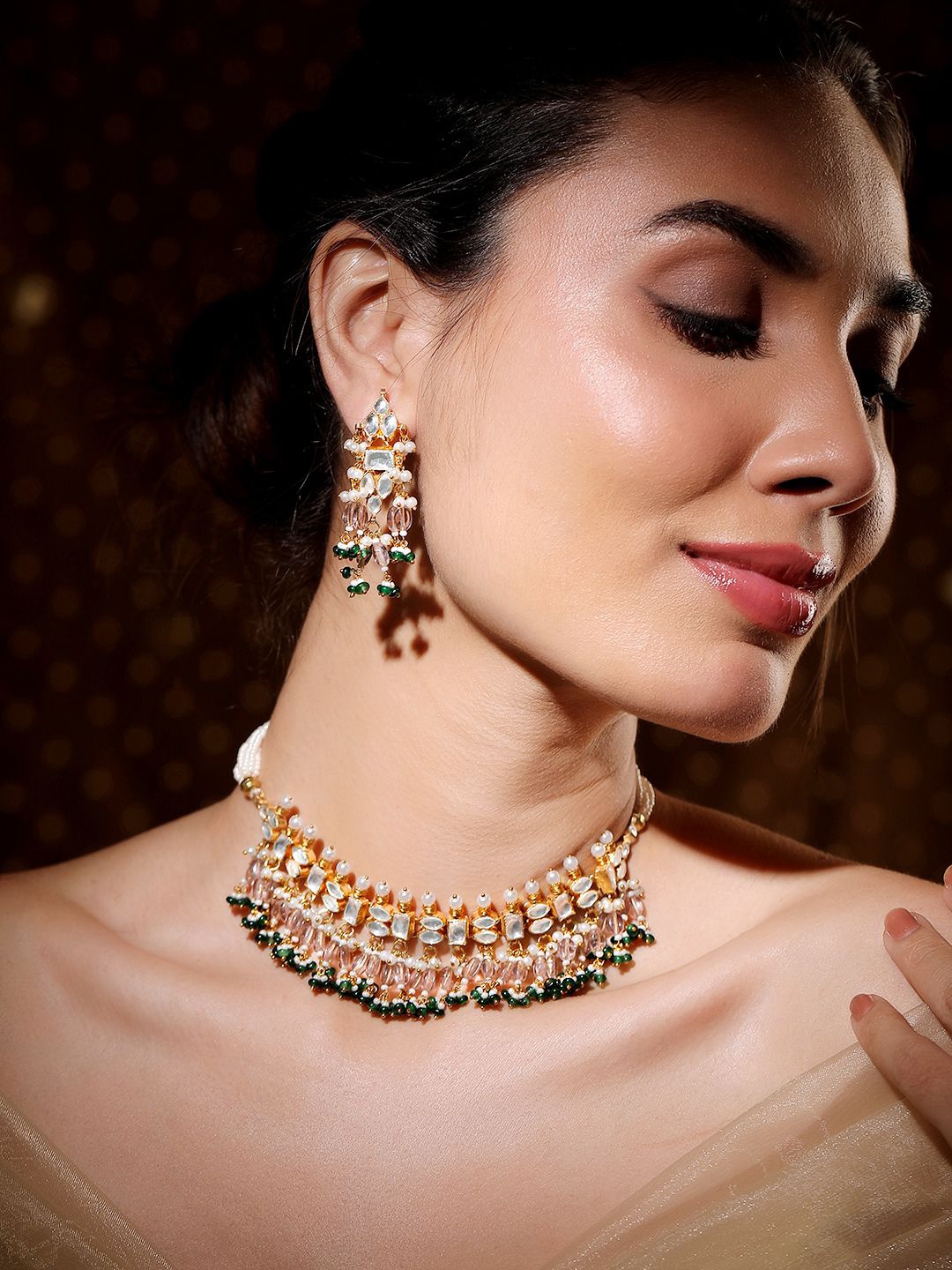Rubans 24K Gold-Plated Pachi Kundan Choker Set with Light Gold Beads & Green Accents
Rubans 24K Gold-Plated Pachi Kundan Choker Set with Light Gold Beads & Green Accents