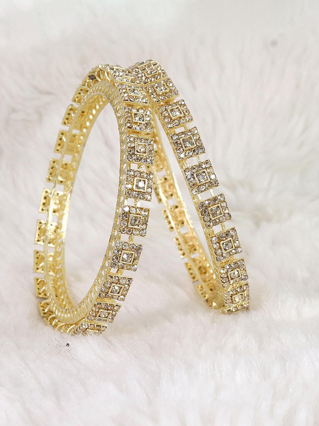 ZULKA Set of 2 Gold Plated Metal with Zircon Stones Pacheli Style Traditional Kada Bangles
ZULKA Set of 2 Gold Plated Metal with Zircon Stones Pacheli Style Traditional Kada Bangles