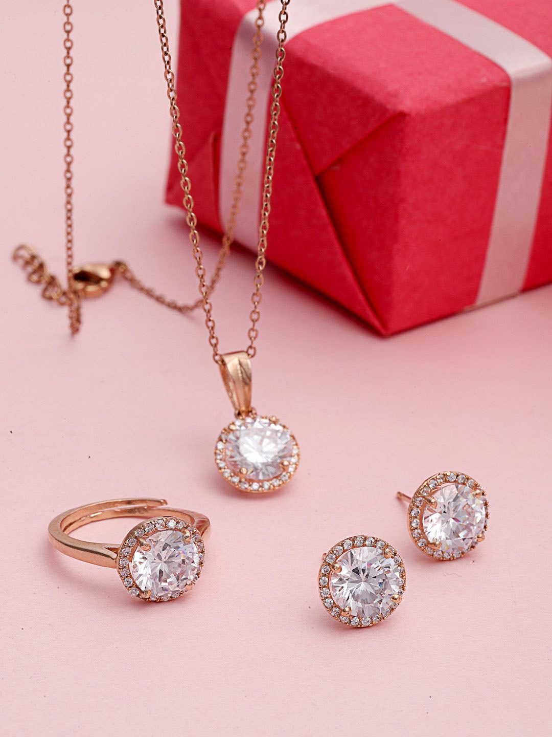PANASH Gold-Plated Cubic Zirconia Studded Solitaire Pendant with Earrings & Ring
PANASH Gold-Plated Cubic Zirconia Studded Solitaire Pendant with Earrings & Ring