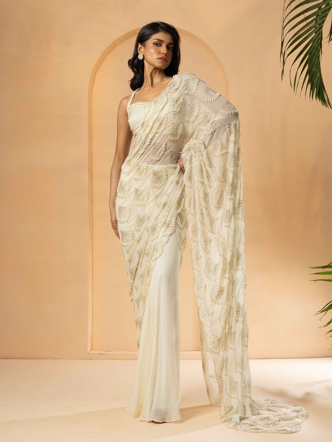 Quench A Thirst Ethnic Motifs Beads and Stones Pure Georgette Pre-Draped Saree, Cream
Quench A Thirst Ethnic Motifs Beads and Stones Pure Georgette Pre-Draped Saree, Cream