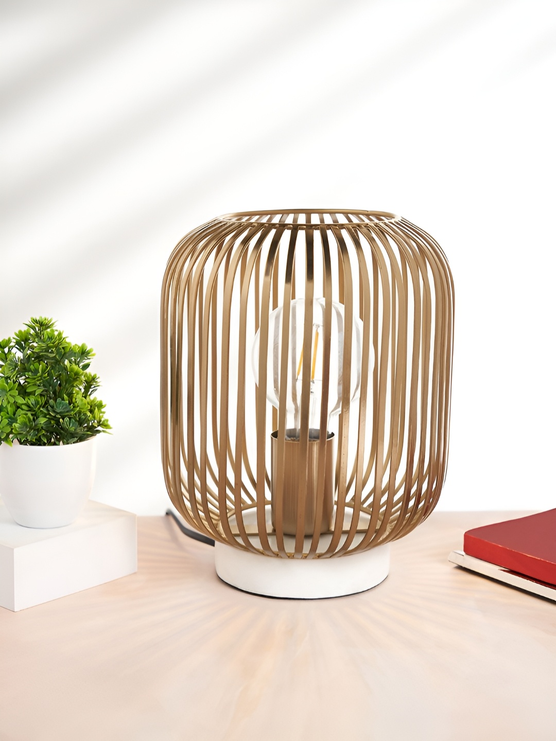 Living scapes by Pantaloons Gold-Toned Metal Contemporary Cylindrical Shaped Table Lamp
Living scapes by Pantaloons Gold-Toned Metal Contemporary Cylindrical Shaped Table Lamp