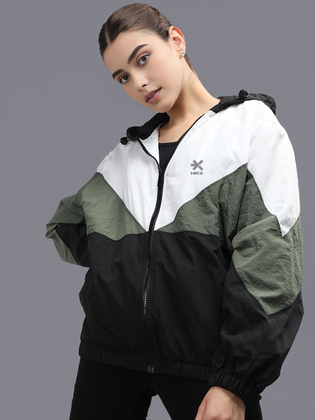 HRX by Hrithik Roshan Women Hooded Colourblocked Sporty Windcheater Jacket, White
HRX by Hrithik Roshan Women Hooded Colourblocked Sporty Windcheater Jacket, White