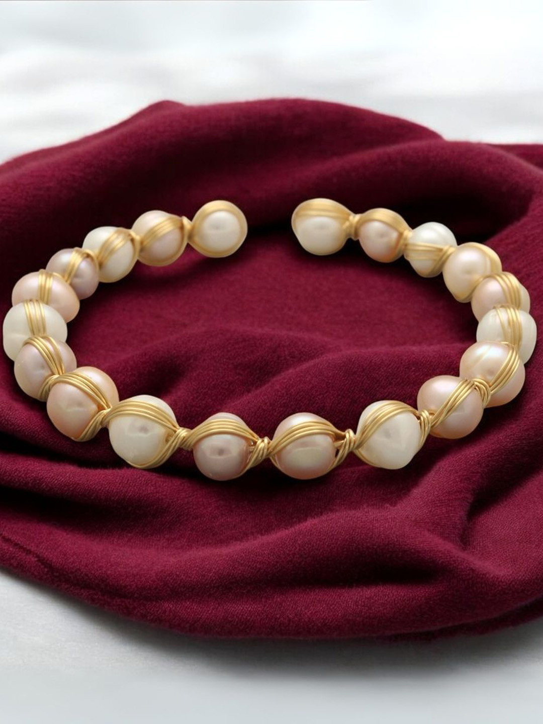 Sri Jagdamba Pearls Dealer Gold-Plated Pearl Cuff Bracelet
Sri Jagdamba Pearls Dealer Gold-Plated Pearl Cuff Bracelet