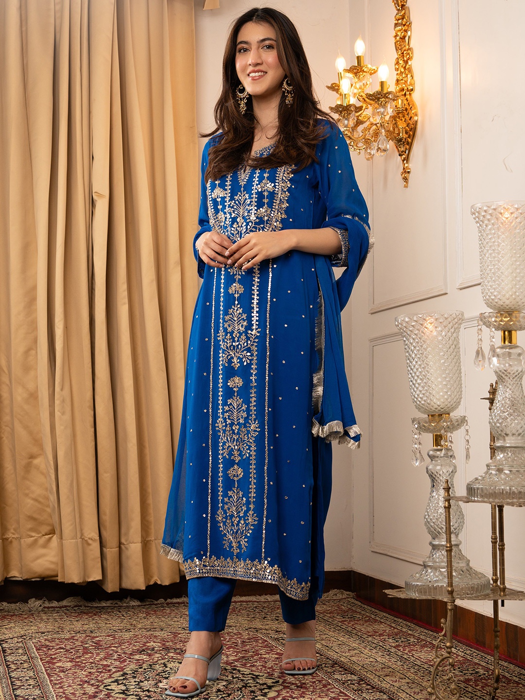 DIMPLE DESIGN STUDIO Women Floral Embroidered Sequinned Kurta with Trouser & Dupatta, Blue
DIMPLE DESIGN STUDIO Women Floral Embroidered Sequinned Kurta with Trouser & Dupatta, Blue