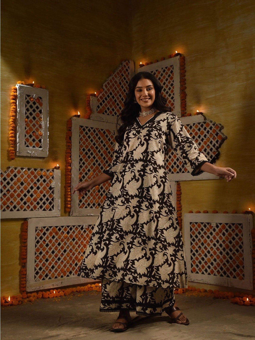 DIMPLE DESIGN STUDIO Floral Printed V-Neck Pure Cotton A-Line Kurta with Palazzos, Black
DIMPLE DESIGN STUDIO Floral Printed V-Neck Pure Cotton A-Line Kurta with Palazzos, Black