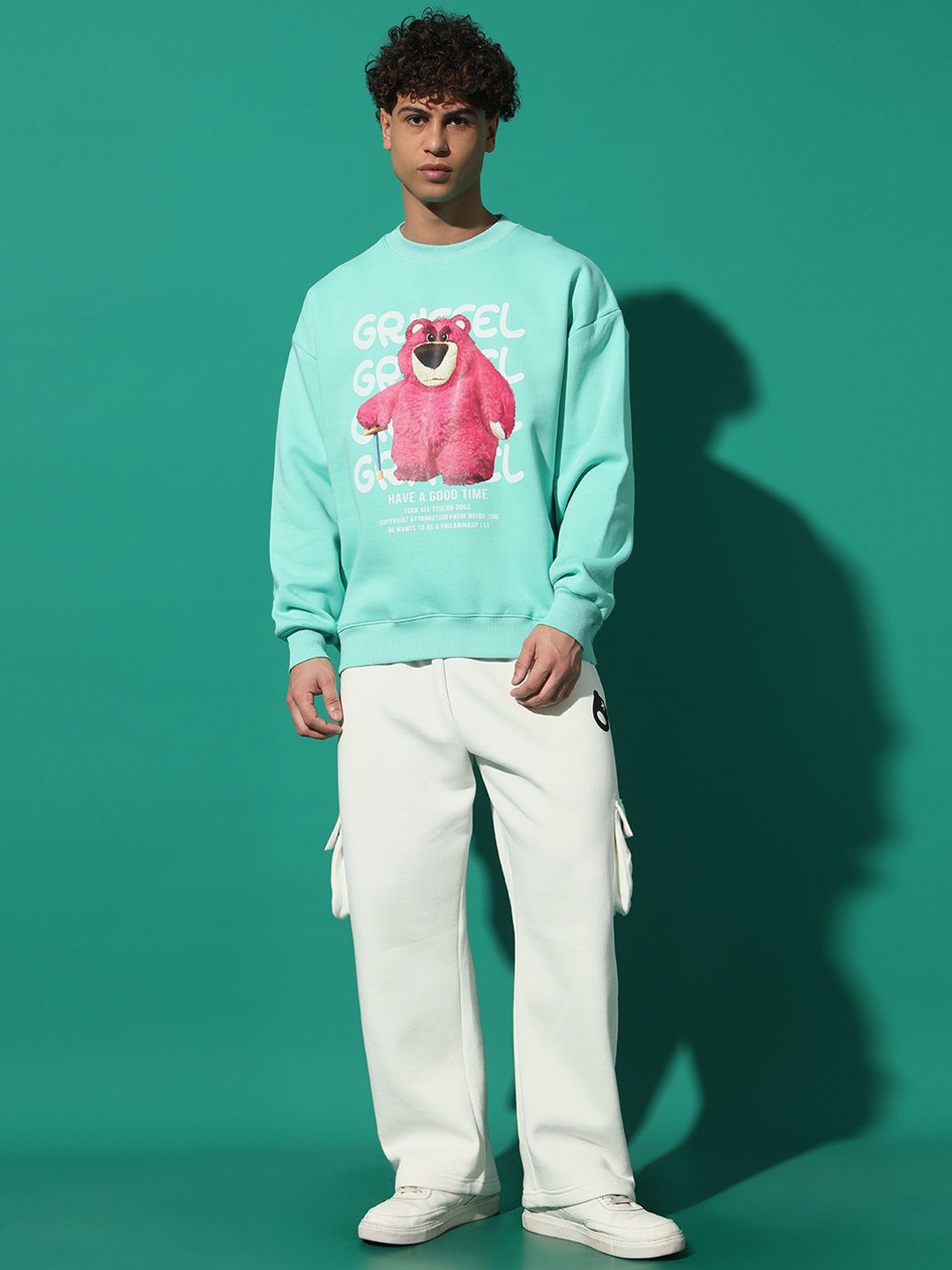 GRIFFEL Men Printed Oversized Sweatshirt With Mid Rise Track Pant, Turquoise blue
GRIFFEL Men Printed Oversized Sweatshirt With Mid Rise Track Pant, Turquoise blue