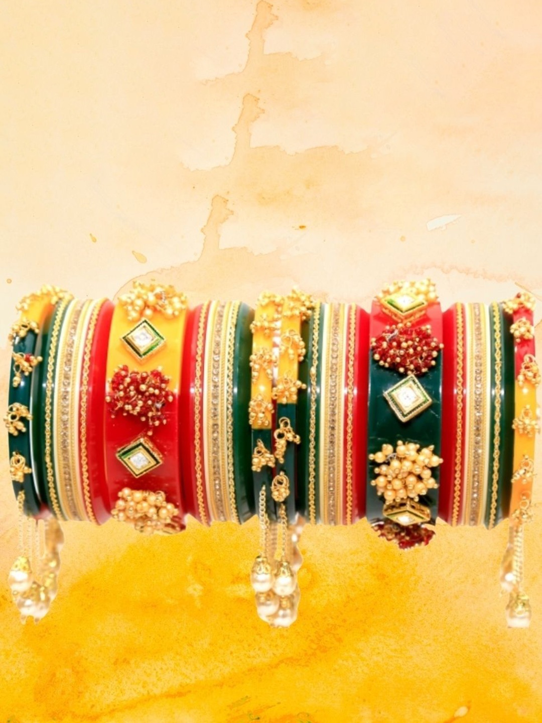 Zindura Set of 2 Gold-Plated Artificial Stone-Studded & Beaded Chuda Bangles With Hangings
Zindura Set of 2 Gold-Plated Artificial Stone-Studded & Beaded Chuda Bangles With Hangings