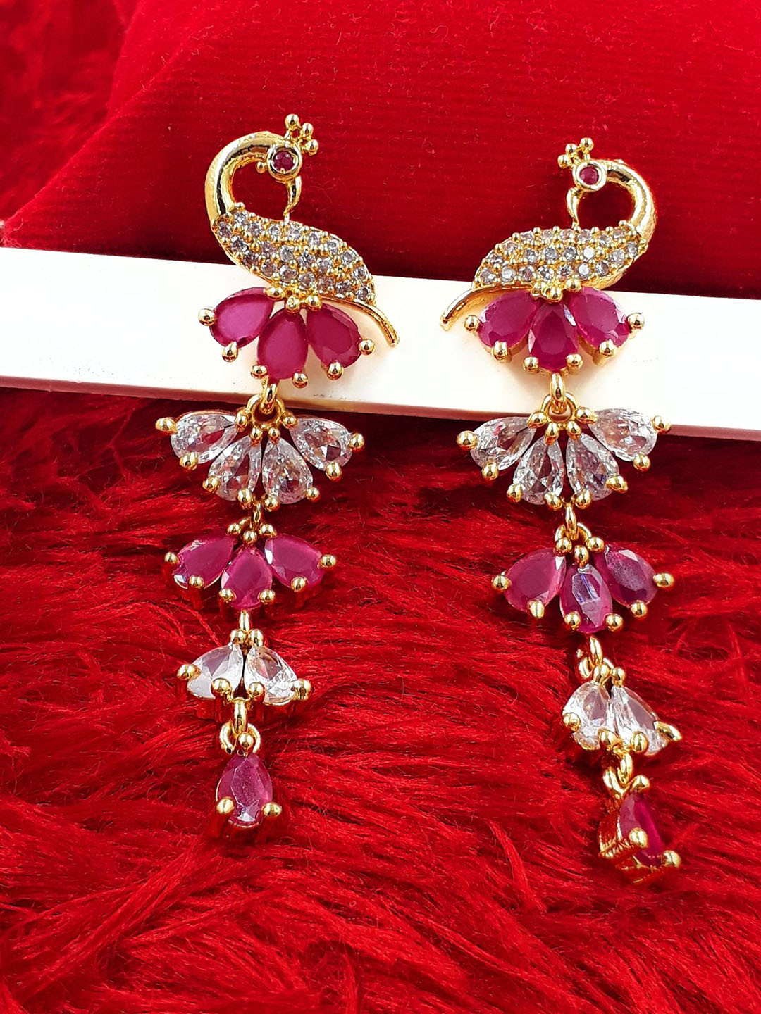 Anujeet Fashion Hub Gold-Plated American Diamond Studded Peacock Shaped Drop Earrings
Anujeet Fashion Hub Gold-Plated American Diamond Studded Peacock Shaped Drop Earrings